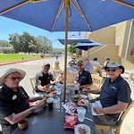 Covenant Living at Mount Miguel in Spring Valley, CA, residents enjoy dining together during a golf outing