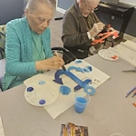 Charter Senior Living of Bowie resident activity - painting