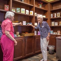 Franklin Park at Sonterra residents talking in the library