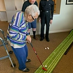 Beachwood Commons by New Perspective in Beachwood, OH, resident enjoying a fun indoor game with good company