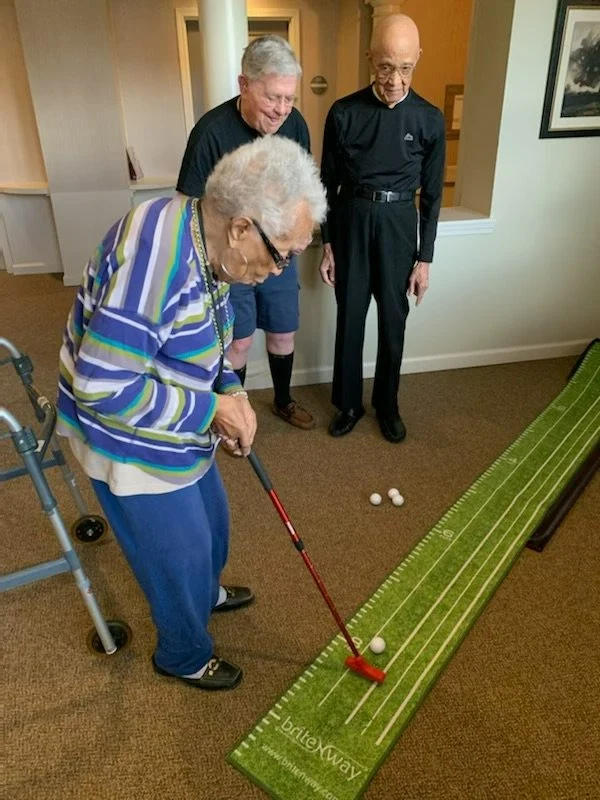 Beachwood Commons by New Perspective in Beachwood, OH, resident enjoying a fun indoor game with good company