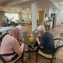 Faith Cottages Memory Care Basehor, KS, resident enjoys painting activity