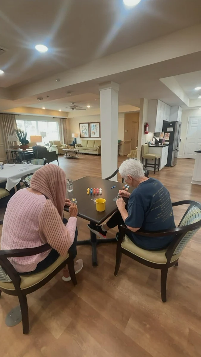 Faith Cottages Memory Care Basehor, KS, resident enjoys painting activity
