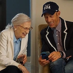 Sage Independence residents laughing at a cell phone