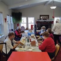 Summerville Estates Gracious Retirement Living Hawthorn Senior Independent Living in Summerville, South Carolina residents making festive gingerbread houses