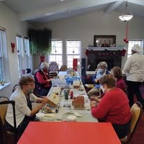 Summerville Estates Gracious Retirement Living Hawthorn Senior Independent Living in Summerville, South Carolina residents making festive gingerbread houses