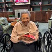 seniors eating treat at Serenades at Longwood