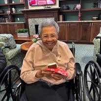 seniors eating treat at Serenades at Longwood