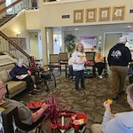 Avamere at Moses Lake senior living community offering independent living, assisted living, and respite care in Moses Lake, WA, residents in the living room area enjoying snacks during a celebration