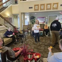 Avamere at Moses Lake senior living community offering independent living, assisted living, and respite care in Moses Lake, WA, residents in the living room area enjoying snacks during a celebration