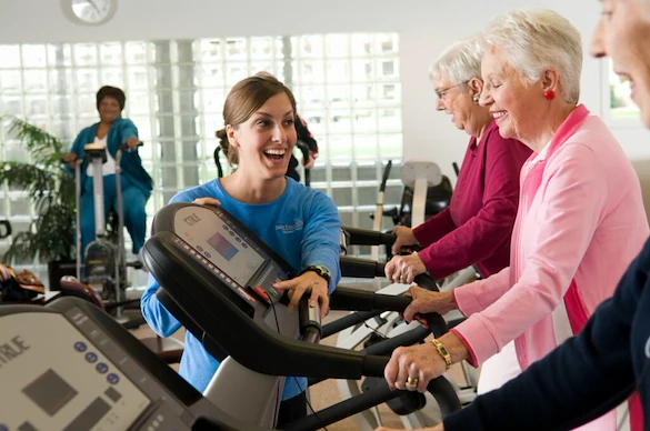 John Knox Village Senior Living CCRC near Kansas City, MO residents exercising in the gym fitness center
