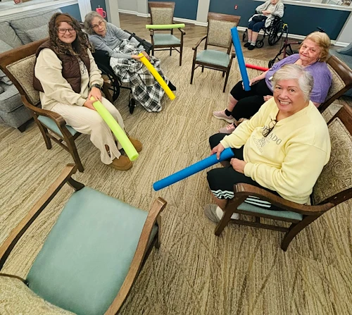 Bennett Place in New Albany, IN, residents staying active with a fun activity using pool noodles