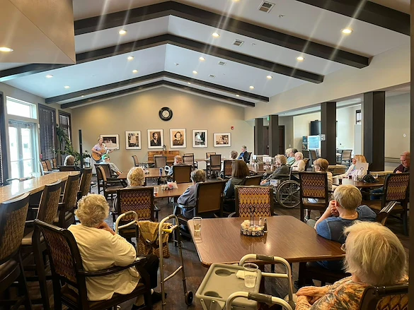 Park Vista Retirement Living - Camanche, IA, residents enjoy entertainment