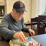 The Barclay at Charlottesville resident enjoys playing a game