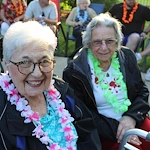 Prime Healthcare Senior Living – Fox Knoll Village in Aurora, IL, smiling residents enjoying an outdoor community event
