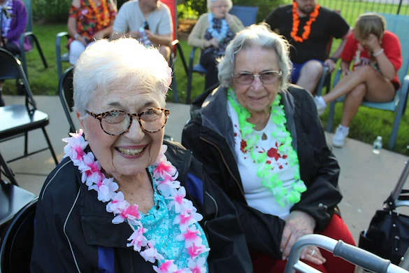 Prime Healthcare Senior Living – Fox Knoll Village in Aurora, IL, smiling residents enjoying an outdoor community event