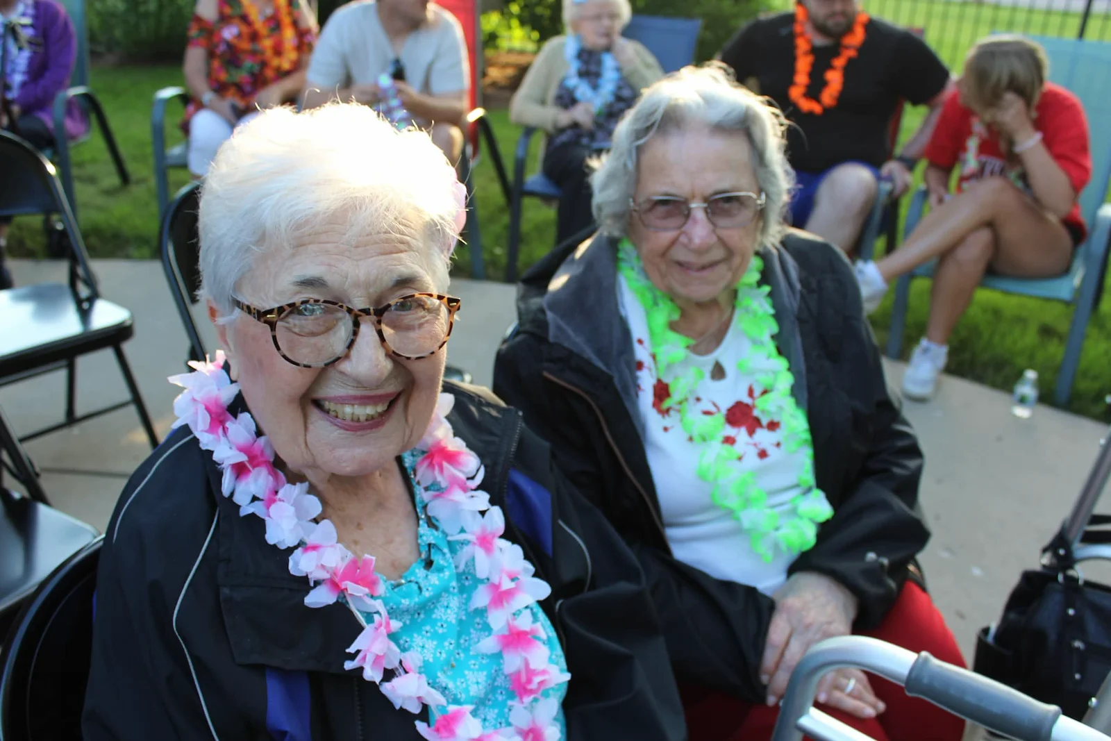 Prime Healthcare Senior Living – Fox Knoll Village in Aurora, IL, smiling residents enjoying an outdoor community event