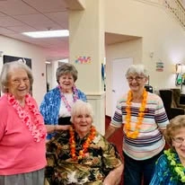 Glenmoore Gracious Retirement Living Hawthorn Senior Independent Living in Happy Valley, Oregon residents at a Hawaiian party