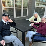 Astral at Auburn, senior living community offering independent living, assisted living, and memory care in Auburn, IN, residents enjoying the weather outside