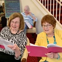 Glenmoore Gracious Retirement Living Hawthorn Senior Independent Living in Happy Valley, Oregon residents reading a book