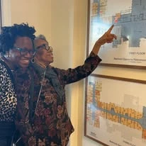 Belmont Gardens Gracious Retirement Living Hawthorn Senior Independent Living in Woodbridge, Virginia residents pointing at building map