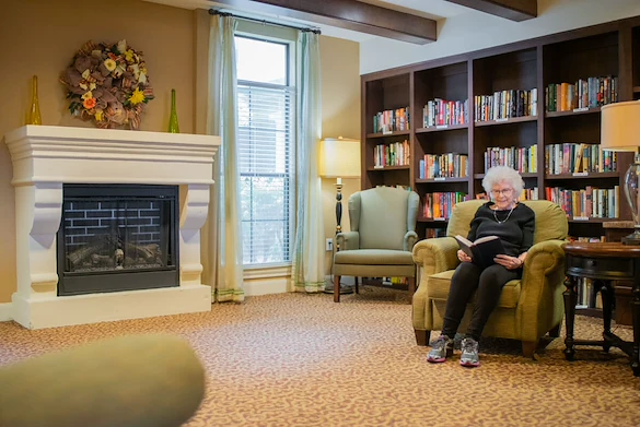Franklin Park Alamo Heights resident reading a book in the library