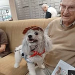 Oak Park Retirement Hawthorn Senior Independent Living in Salisbury, North Carolina resident holding a dog