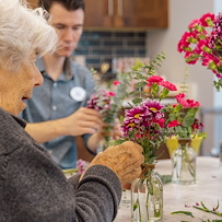 Fieldstone Memory Care of Bainbridge resident activity - arranging flowers