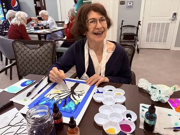 A Vincent Senior Living resident enjoying the Paint & Prayer event