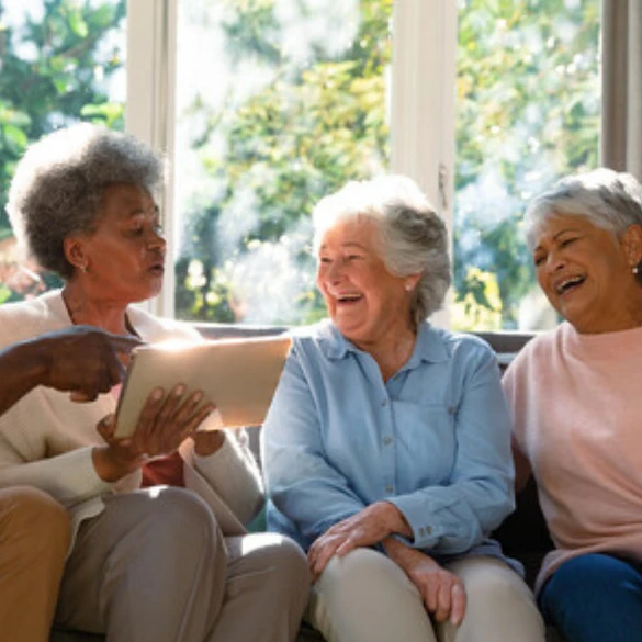 diverse group of happy seniors on a couch