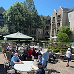 Covenant Living at Inverness in Tulsa, OK, residents enjoying the outdoors during an event