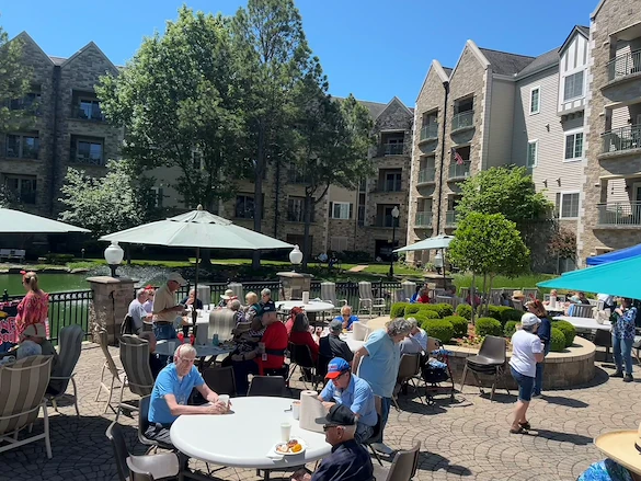 Covenant Living at Inverness in Tulsa, OK, residents enjoying the outdoors during an event