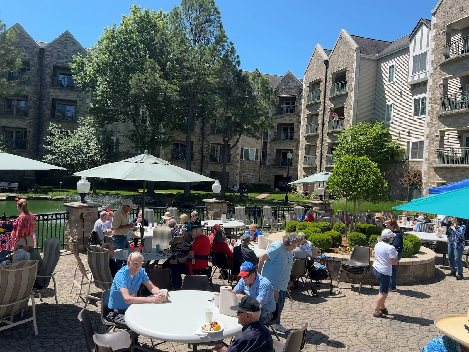 Covenant Living at Inverness in Tulsa, OK, residents enjoying the outdoors during an event