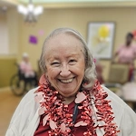 Pomeroy Living Sterling Senior Living smiling resident enjoying a celebration for Valentine's Day