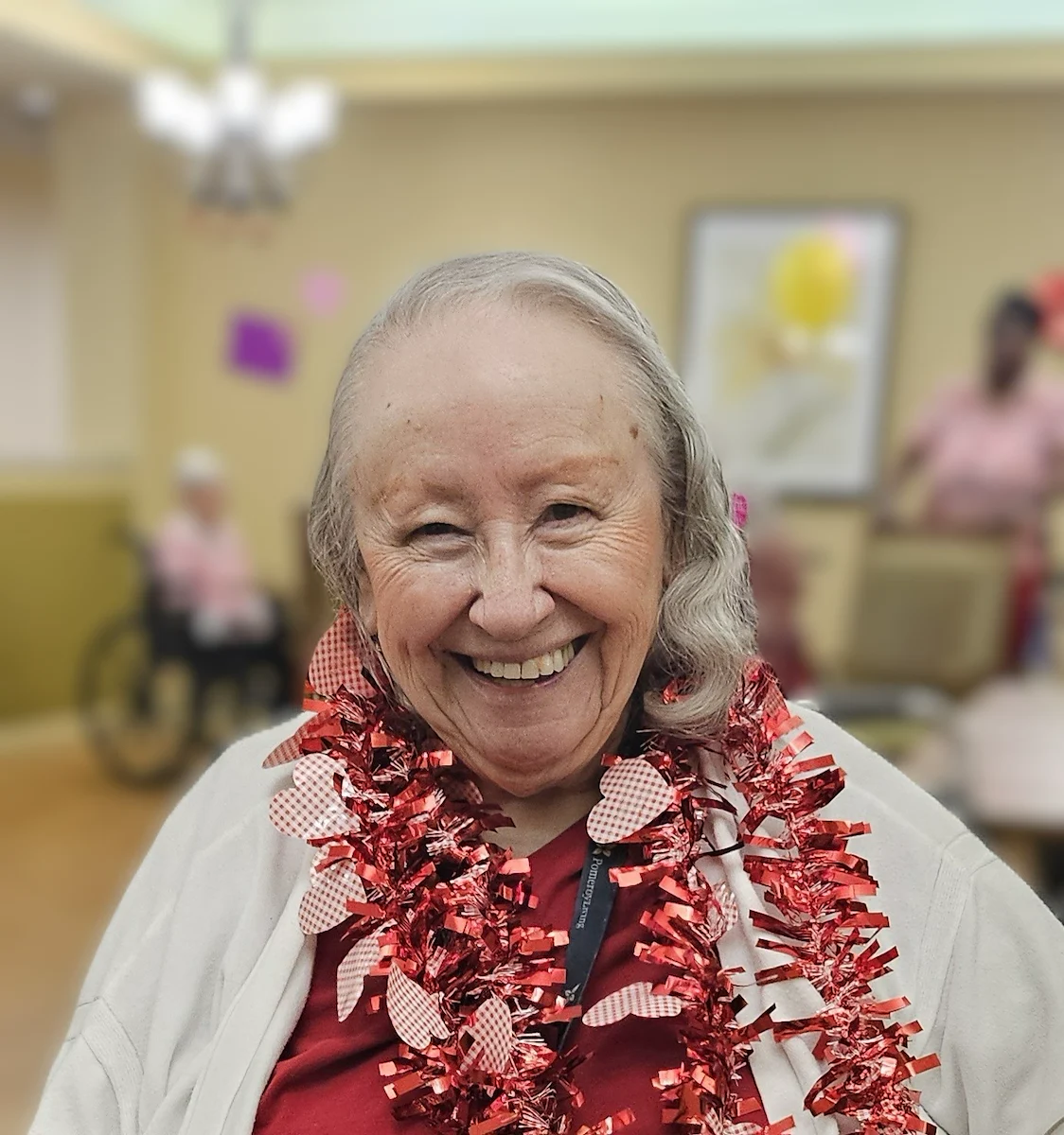 Pomeroy Living Sterling Senior Living smiling resident enjoying a celebration for Valentine's Day