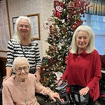 Allisonville Meadows Assisted Living offering assisted living, memory care, and respite care in Fishers, IN, residents smiling during the Christmas season