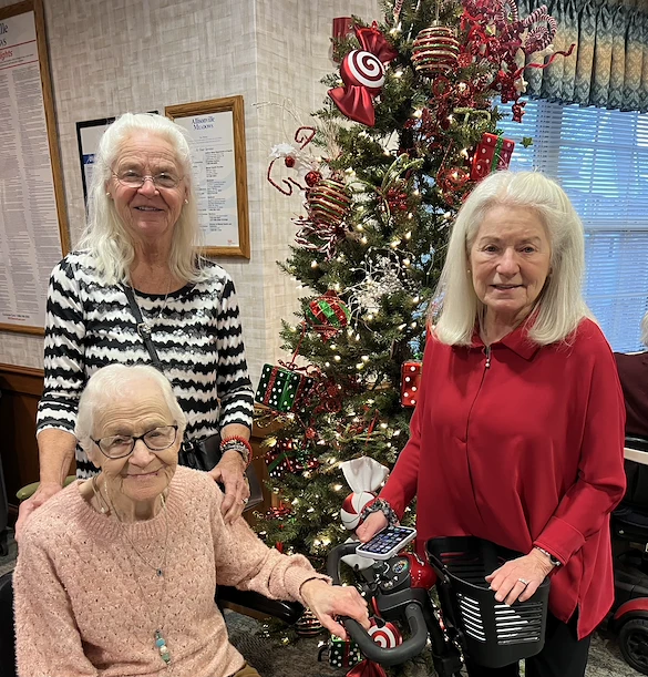 Allisonville Meadows Assisted Living offering assisted living, memory care, and respite care in Fishers, IN, residents smiling during the Christmas season
