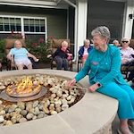 Ashton Gardens Gracious Retirement Living Hawthorn Senior Living Community in Portland, Maine residents making s'mores