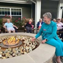 Ashton Gardens Gracious Retirement Living Hawthorn Senior Living Community in Portland, Maine residents making s'mores