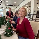 Osprey Heights Gracious Retirement Living Hawthorn Senior Independent Living in Valrico, Florida residents decorating Christmas trees