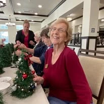 Osprey Heights Gracious Retirement Living Hawthorn Senior Independent Living in Valrico, Florida residents decorating Christmas trees