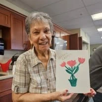 Avamere at Englewood Heights senior living community offering assisted living, memory care, and respite care in Yakima, WA, resident showing her art project