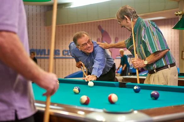 John Knox Village Senior Living CCRC near Kansas City, MO residents playing pool