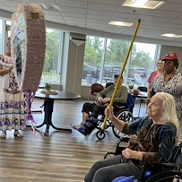 Long House senior living community offering independent living and respite care in Erlanger, KY, residents enjoying an activity with a pinata