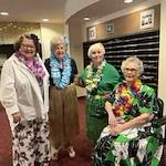 Liberty Heights Gracious Retirement Living Hawthorn Senior Independent Living in Rockwall, Texas residents at a Hawaiian themed party
