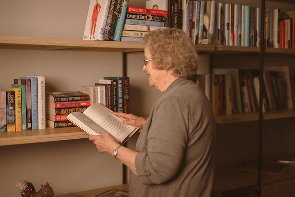 woman reading in library
