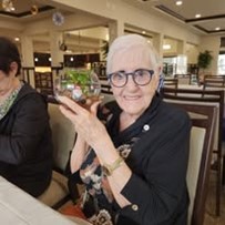 Hudson Estates Gracious Retirement Living Hawthorn Senior Independent Living in Lansdale, Pennsylvania resident showing off gnome garden craft