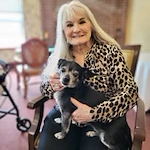 Gilman Grove Assisted Senior Living in Oregon City, Oregon resident holding a puppy
