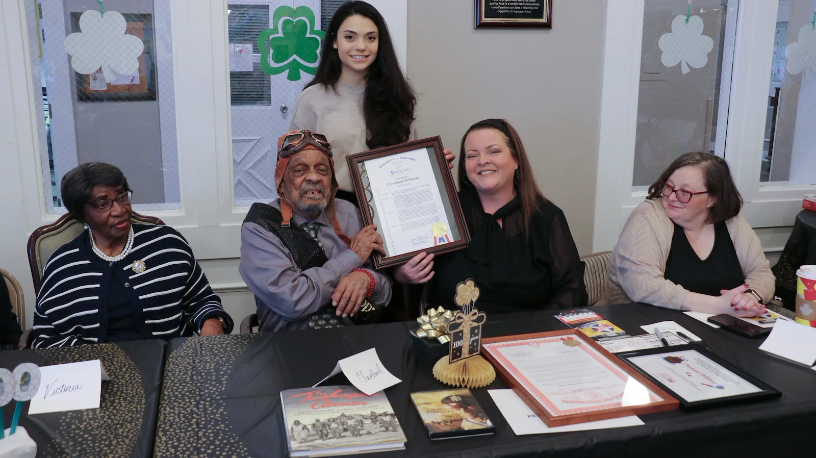 American House Dearborn Heights, senior living community offering independent living and respite care in Dearborn Heights, MI, resident smiling and receiving recognition