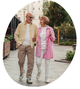 two seniors walking outside